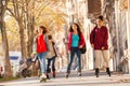 Happy friends rollerblading on sidewalk in autumn Royalty Free Stock Photo