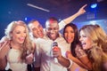 Happy friends singing at the karaoke Royalty Free Stock Photo