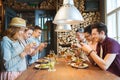 Happy friends with smartphones picturing food Royalty Free Stock Photo