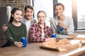 Happy friends spending time together with pizza and soda drinks Royalty Free Stock Photo