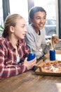 Happy friends spending time together with pizza and soda drinks Royalty Free Stock Photo