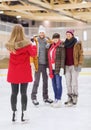 Happy friends taking photo on skating rink Royalty Free Stock Photo