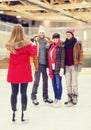 Happy friends taking photo on skating rink Royalty Free Stock Photo