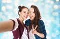 Happy friends taking selfie and showing peace Royalty Free Stock Photo