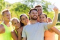 Happy friends taking selfie with smartphone Royalty Free Stock Photo