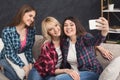 Happy friends taking selfie on smartphone Royalty Free Stock Photo