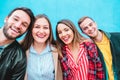 Happy friends taking selfie with turquoise background - Students having fun with technology trends at erasmus university - Youth, Royalty Free Stock Photo