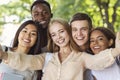 Happy friends taking selfie while walking in park Royalty Free Stock Photo