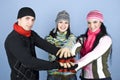 Happy friends with their hands together in unity Royalty Free Stock Photo