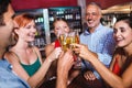 Friends toasting champagne glass in nightclub Royalty Free Stock Photo