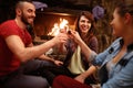 Happy friends toasting with glasses of drink Royalty Free Stock Photo