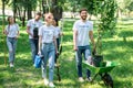 happy friends volunteering and planting trees Royalty Free Stock Photo