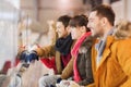 Happy friends watching hockey game on skating rink Royalty Free Stock Photo