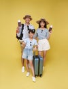 Happy fun asian family vacation portrait. Father, mother and daughters ready for travel flight with suitcase Royalty Free Stock Photo