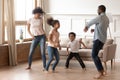Happy funny active african family of four dancing at home Royalty Free Stock Photo