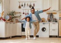 Happy funny african american family excited little boy son having fun with father at home