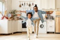 Happy funny african american family excited little boy son having fun with father at home Royalty Free Stock Photo