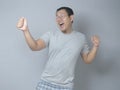 Happy Funny Asian Man Dancing Full of Joy Royalty Free Stock Photo