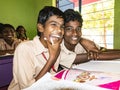 Happy funny children friends boys classmates smiling laughing in classroom at the school