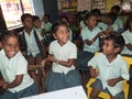 Happy funny children friends girls and boys classmates smiling laughing in classroom at the school Royalty Free Stock Photo