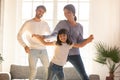 Happy family and child daughter laughing dancing in living room Royalty Free Stock Photo