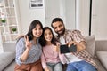 Happy funny indian family with teen daughter taking selfie on phone at home. Royalty Free Stock Photo