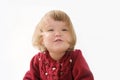 Happy funny little girl emotional playing. cute caucasian blond baby girl with bear and doll