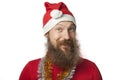 Happy funny santa claus with real beard and red hat and shirt making crazy face and smiling, looking and camera