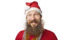 Happy funny santa claus with real beard and red hat and shirt making crazy face and smiling, looking and camera