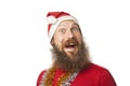 Happy funny santa claus with real beard and red hat and shirt making crazy face and smiling, looking and camera Royalty Free Stock Photo