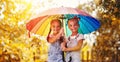 Happy funny sisters twins child girl with umbrella in autumn Royalty Free Stock Photo