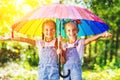 Happy funny sisters twins child girl with umbrella Royalty Free Stock Photo