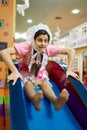 Happy funny woman newborn baby in daycare center Royalty Free Stock Photo