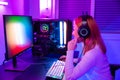 Happy Gamer endeavor plays online video games tournament with computer neon lights