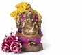 Happy Ganesh Chaturthi - Clay Ganesh idol with flowers on white background