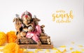 Happy Ganesh Chaturthi festival, Bronze Ganesha statue and Golden texture with flowers, Ganesh is hindu god of Success