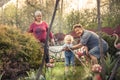 Happy gardener grandparents grandchild together gardening grandparenting concept Royalty Free Stock Photo