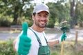 Happy gardener posing while working outside