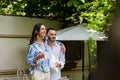 happy gay couple holding cups of Royalty Free Stock Photo