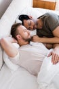 Happy gay couple sleeping together on bed Royalty Free Stock Photo