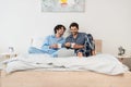 happy gay men watching movie on Royalty Free Stock Photo