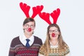 Happy geeky hipster couple with stag headband