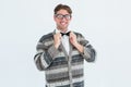 Happy geeky hipster with wool jacket