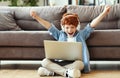 Boy celebrating victory in video game Royalty Free Stock Photo