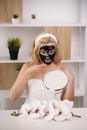 Happy girl applying facial mask - Young woman having skin care spa day - Beauty clean treatment day and cosmetology Royalty Free Stock Photo