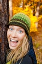 Happy Girl in Autum Forest Hugging Tree Royalty Free Stock Photo