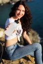 Happy girl backpacker with bottle of water