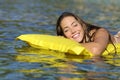 Happy girl bathing on the beach in summer vacation