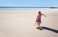 Happy girl, beach and paddle bat with ball for playful summer, holiday weekend or outdoor game in nature. Female person Royalty Free Stock Photo