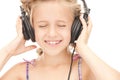 Happy girl in big headphones